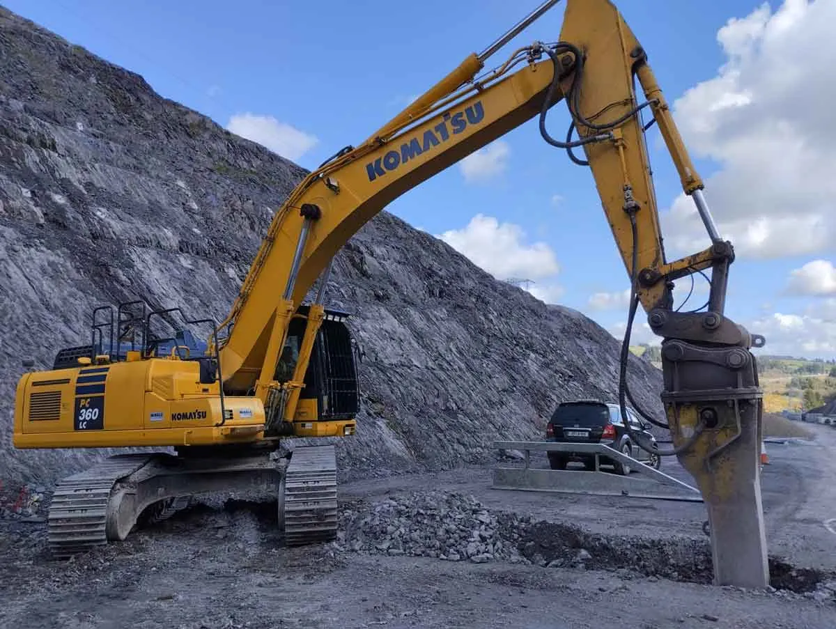 Komatsu PC360 excavator with a hydraulic breaker on a construction site